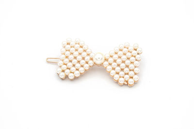 Directly above shot of eggs on white background