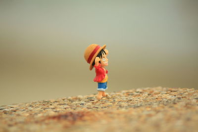 Full length of boy standing on beach