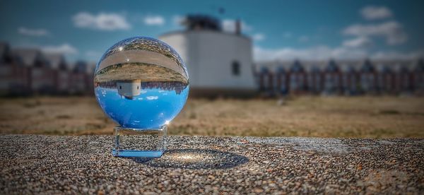 Close-up of crystal ball on glass