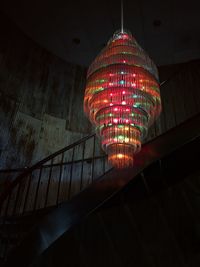 Low angle view of illuminated colorful chandelier hanging
