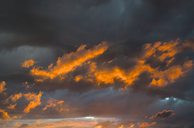 Low angle view of dramatic sky during sunset