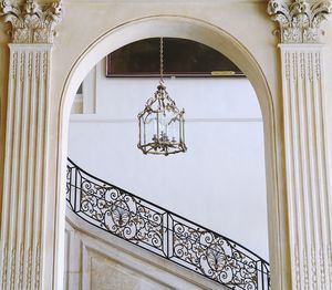 Low angle view of chandelier against building