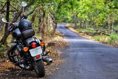 Motorcycle on road in forest