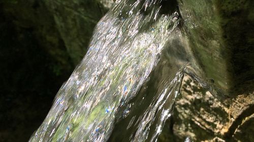 Close-up of water flowing through rocks