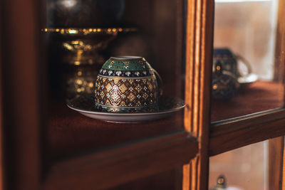 Close-up of glass window on table