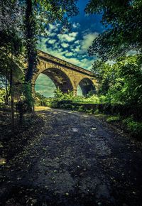 Arch bridge against sky