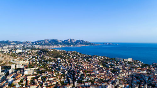 High angle view of cityscape by sea