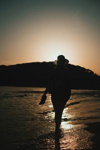 Silhouette of people at sunset