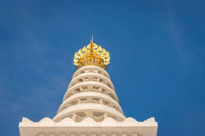 Buddhist stupa top mound isolated with bright blue sky