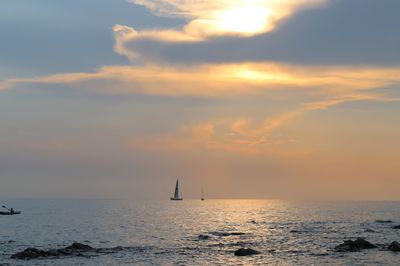 Scenic view of calm sea at sunset