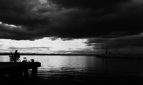 Scenic view of sea against cloudy sky