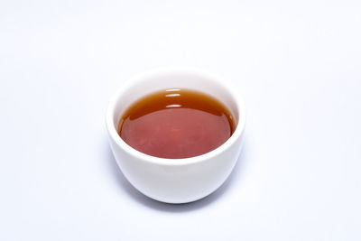 High angle view of tea cup against white background