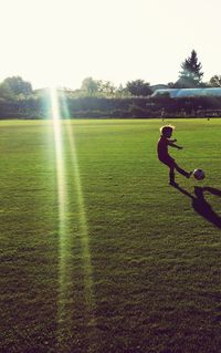 Man playing golf course on field