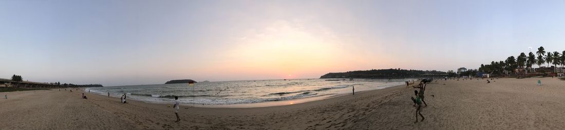 Panoramic view of beach against sky during sunset