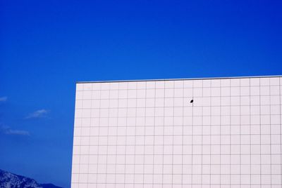 Low angle view of building against blue sky