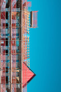 Low angle view of building against clear blue sky