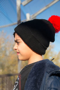 Portrait of boy wearing hat standing outdoors