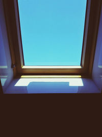 Low angle view of skylight against clear sky