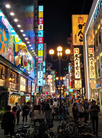 Crowd on illuminated city at night