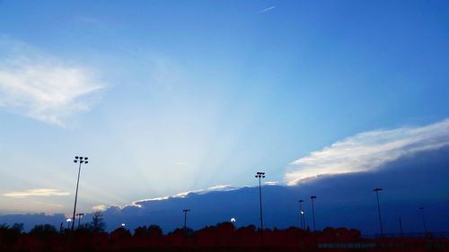 Street lights against sky