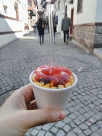 Midsection of person holding ice cream