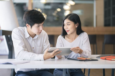 Young couple looking at mobile phone