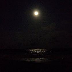 Scenic view of sea against sky at night