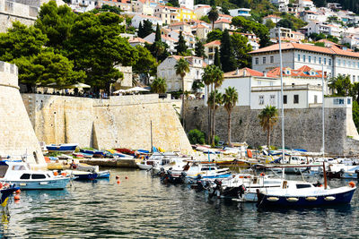 Boats moored at harbor