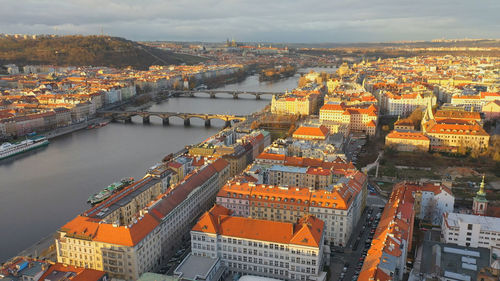 High angle view of river amidst buildings in city