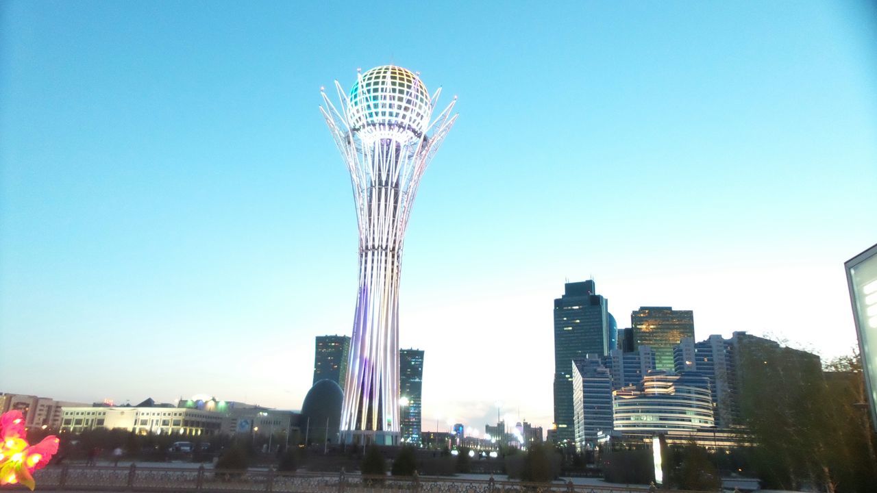 clear sky, architecture, built structure, building exterior, tall - high, skyscraper, city, modern, low angle view, tower, copy space, capital cities, office building, blue, travel destinations, famous place, cityscape, urban skyline, international landmark, tall