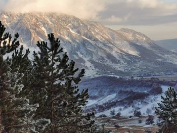 Scenic view of snowcapped mountains against sky