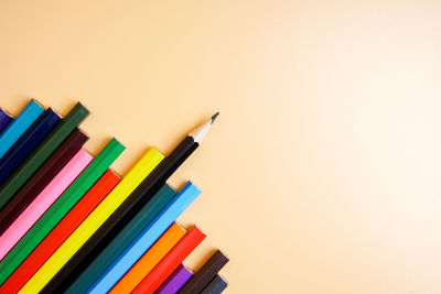 Close-up of colored pencils against white background