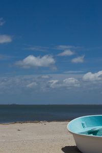 Scenic view of sea against blue sky