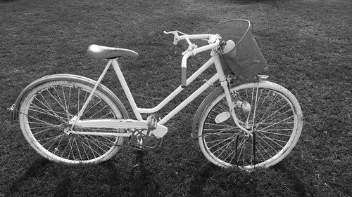 High angle view of abandoned bicycle on field