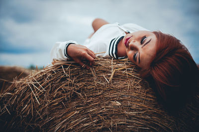 Woman lying down on field