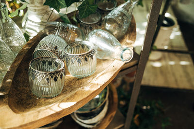 Glass vases in wooden bowl