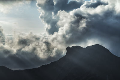 Low angle view of silhouette mountain against sky