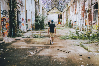 Man walking on cobblestone street