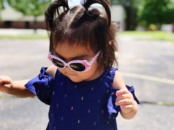 Cute girl wearing sunglasses outdoors
