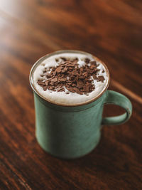 Close-up of coffee cup on table