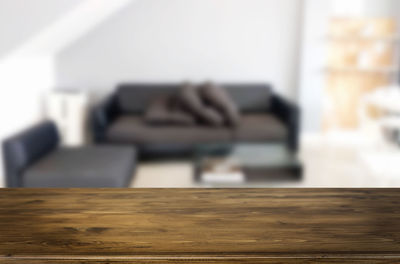 Close-up of mobile phone on sofa at home