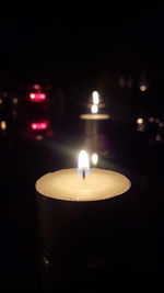 Close-up of illuminated tea light candles