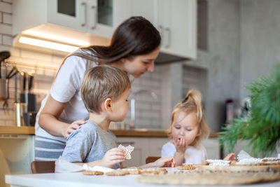 Mother and son on table