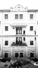 Man in front of residential building