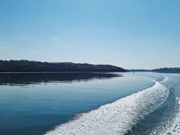 Scenic view of lake against blue sky