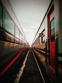 Train on railroad tracks against sky