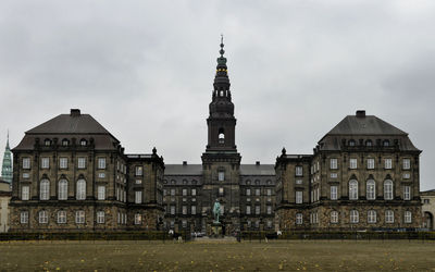 Facade of historic building against sky