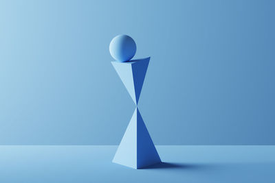 Low angle view of balloons against blue background