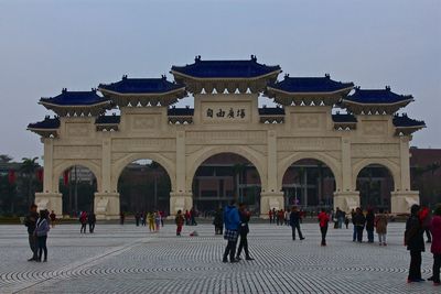 People visiting chiang kai-shek memorial hall against clear sky