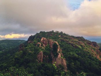 Scenic view of mountains against cloudy sky